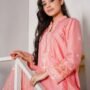 pexels-photo-20614168-20614168 Young woman in pink traditional dress posing gracefully indoors on a staircase.